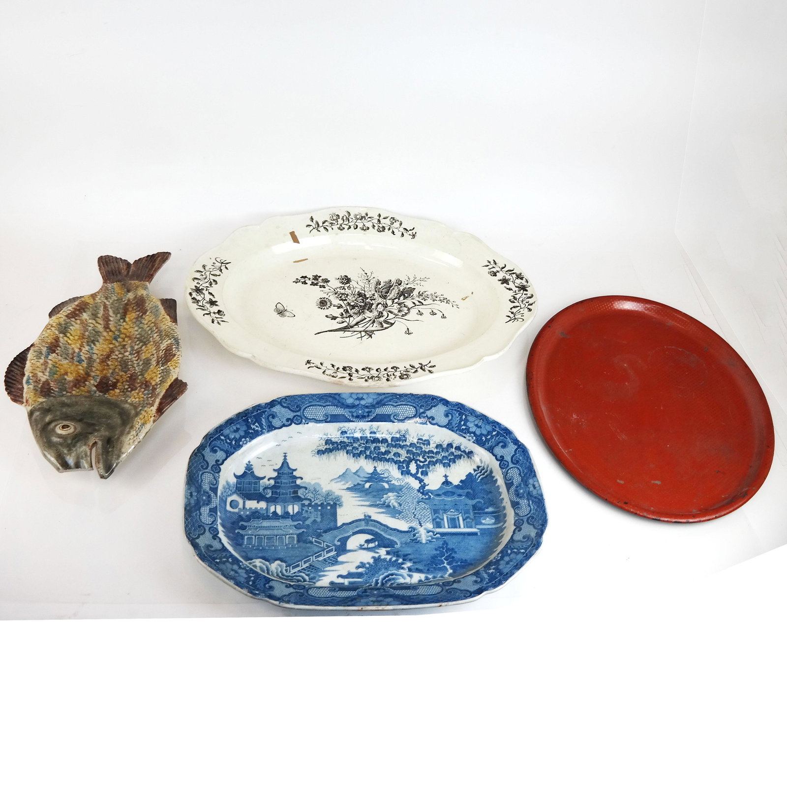 Group of Tole & Ceramic Trays: Group of tole and ceramic trays, with various decorations. Provenance: From the Upper East Side Estate of a prominent NYC interior decorator. [Largest: 21" x 16 1/2"]. All with losses and wear.
