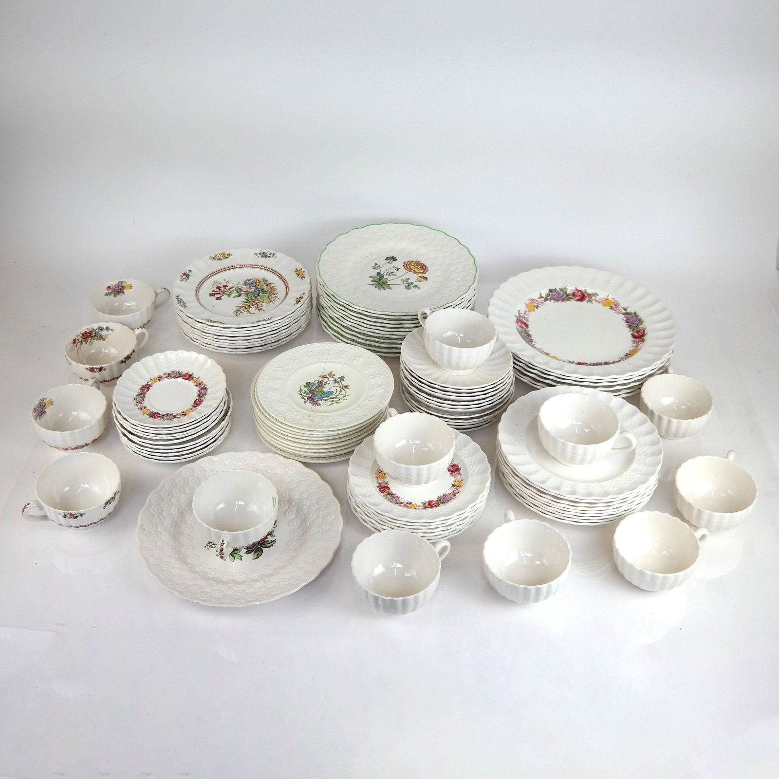 Assembled Group of English Spode Ware: Approximately 80 English Spode cups, saucers and plates, including "Chelsea Wicker", "Rose Briar", "Rosalie" patterns. Marked to bases. Some with cracks, chips, stains and wear.
