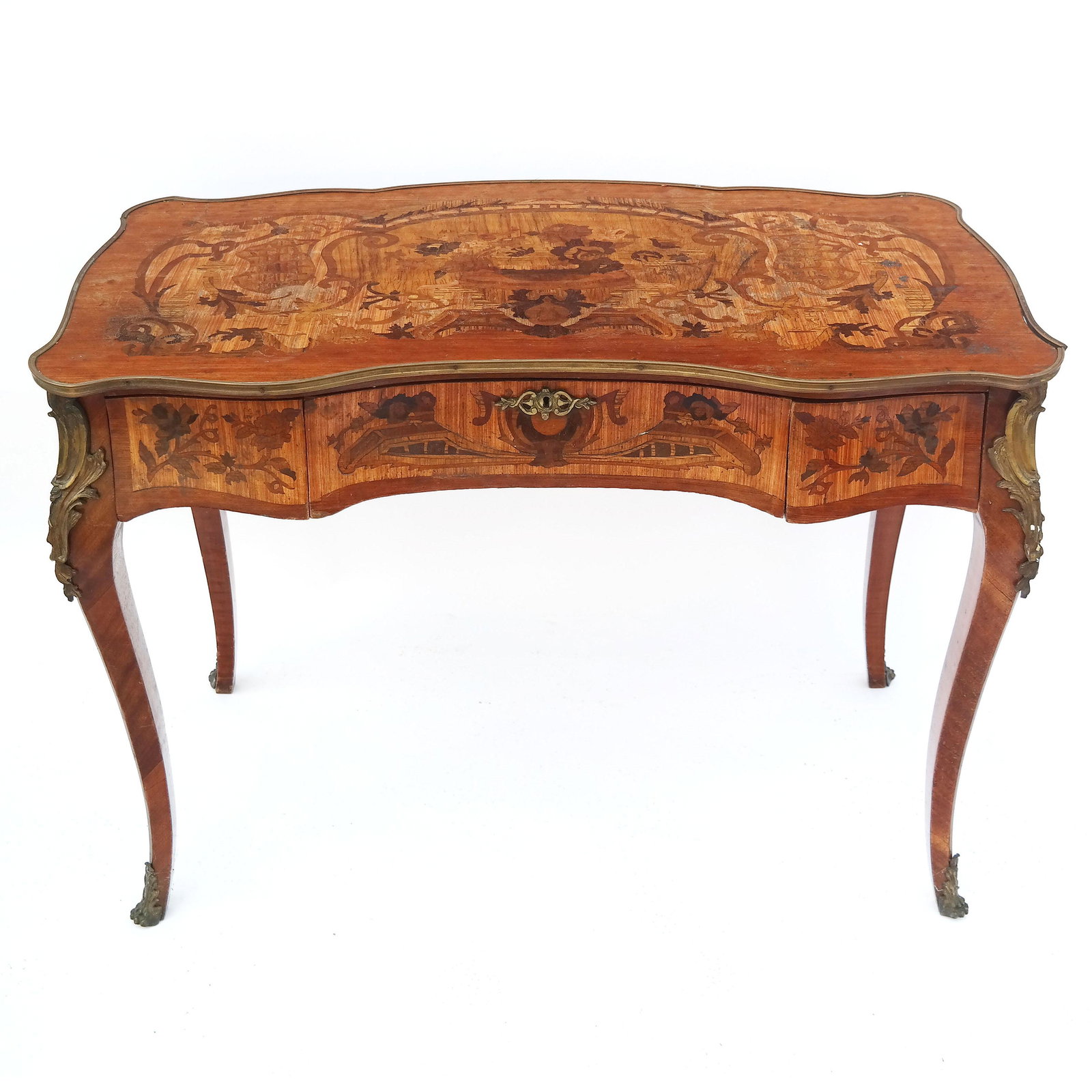 Rococo-Style Marquetry Inlaid Desk: Rococo-style marquetry inlaid desk with floral motifs and gilt metal accents. [31 1/2" H x 44" W x 23 1/2" D]. Some metal bending and loose; fading and wear to case overall.