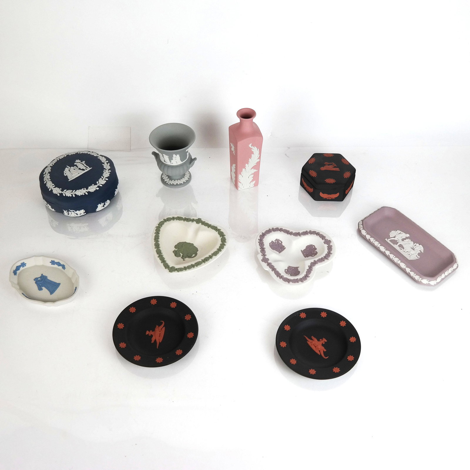 10 Wedgwood Jasperware Items: 10 Wedgwood jasperware items, in red on black, pink, lavender, and other colors. Some rare. In good condition.