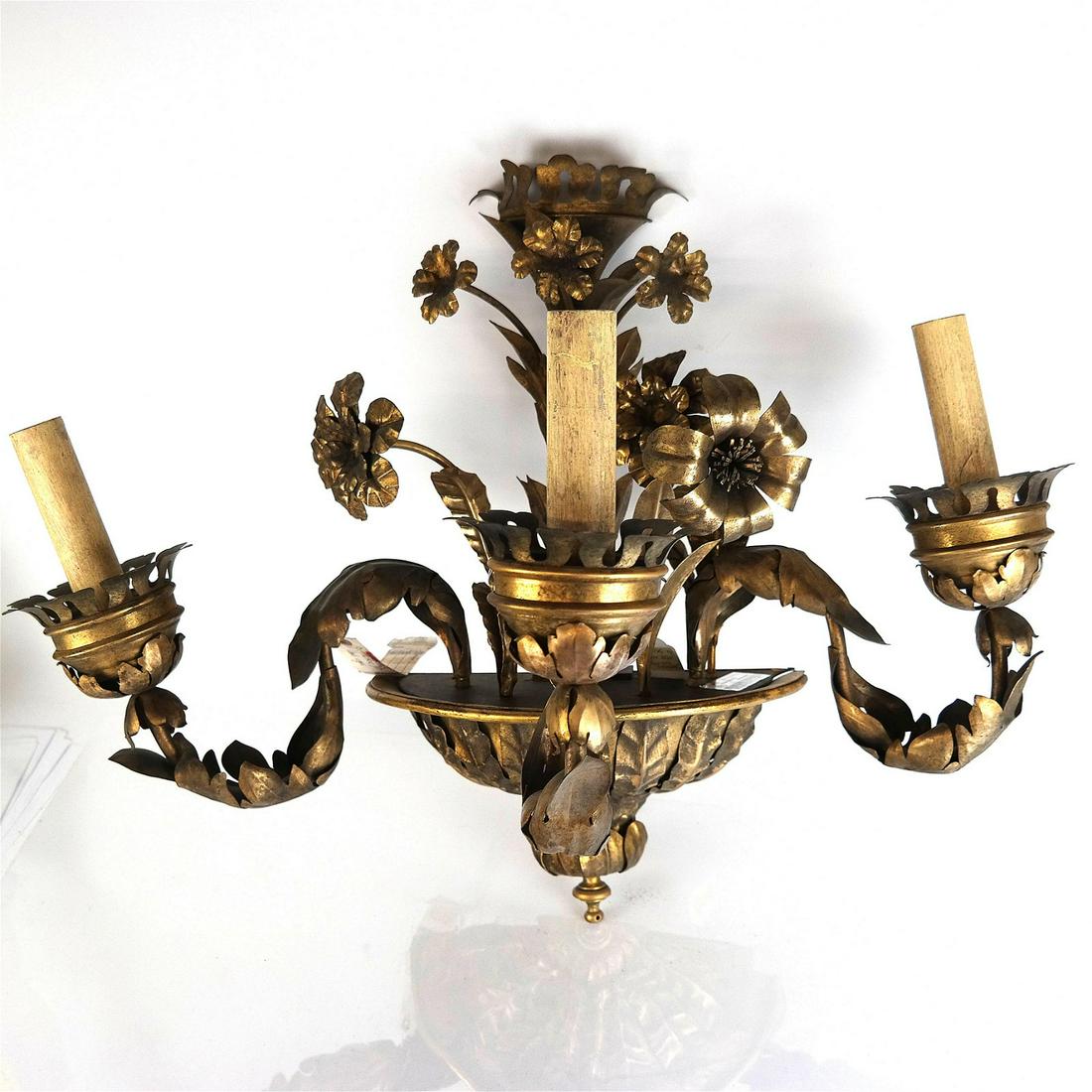 Gilt Tole 3-Arm Sconce: Gilt tole floral design 3-arm sconce, electrified, with bottom finial. [20" H x 26" W x 14" D]. In good condition.