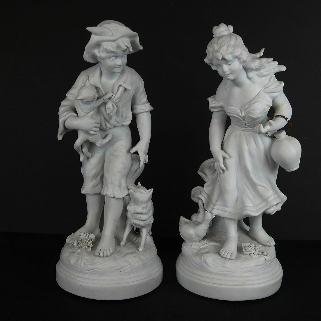 Pair of Bisque Porcelain Figures: Pair of figures comprising a young woman and a young man with animals, Genuine Bisque, made in France. [13" H]. In good condition; no chips, cracks or repairs.