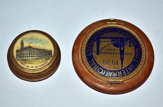 Advertising: Two Compacts: Two advertising compacts: 1939 Golden Gate International Exposition, 3" Dia. x 1/2"H, accompanied by a Siegel Cooper Co. compact with "Meet Me by the Fountain" tag line.