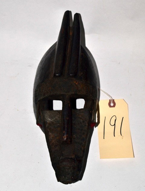 African Carved Wood Mask: With metal face and two horns.
