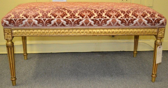 Louis XVI Style Upholstered Giltwood Bench: Giltwood Louis XVI style window bench having rosette form carving at the corners of the legs, with a chain link design trim. Good condition. 40.25" L x 20.5" D x 18.5" H.