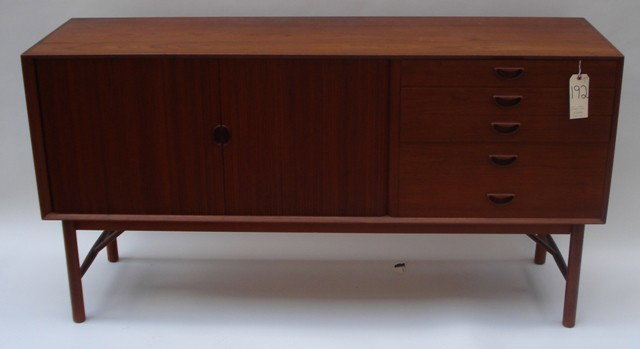 Peter Hvidt Sideboard: Peter Hvidt sideboard with tambour slides,on left, concealing two shelves and five drawers at right. 65.25" W x 19" D x 34.25" H ( Note Peter Hvdit worked with Orla Molgaard- Nielsen