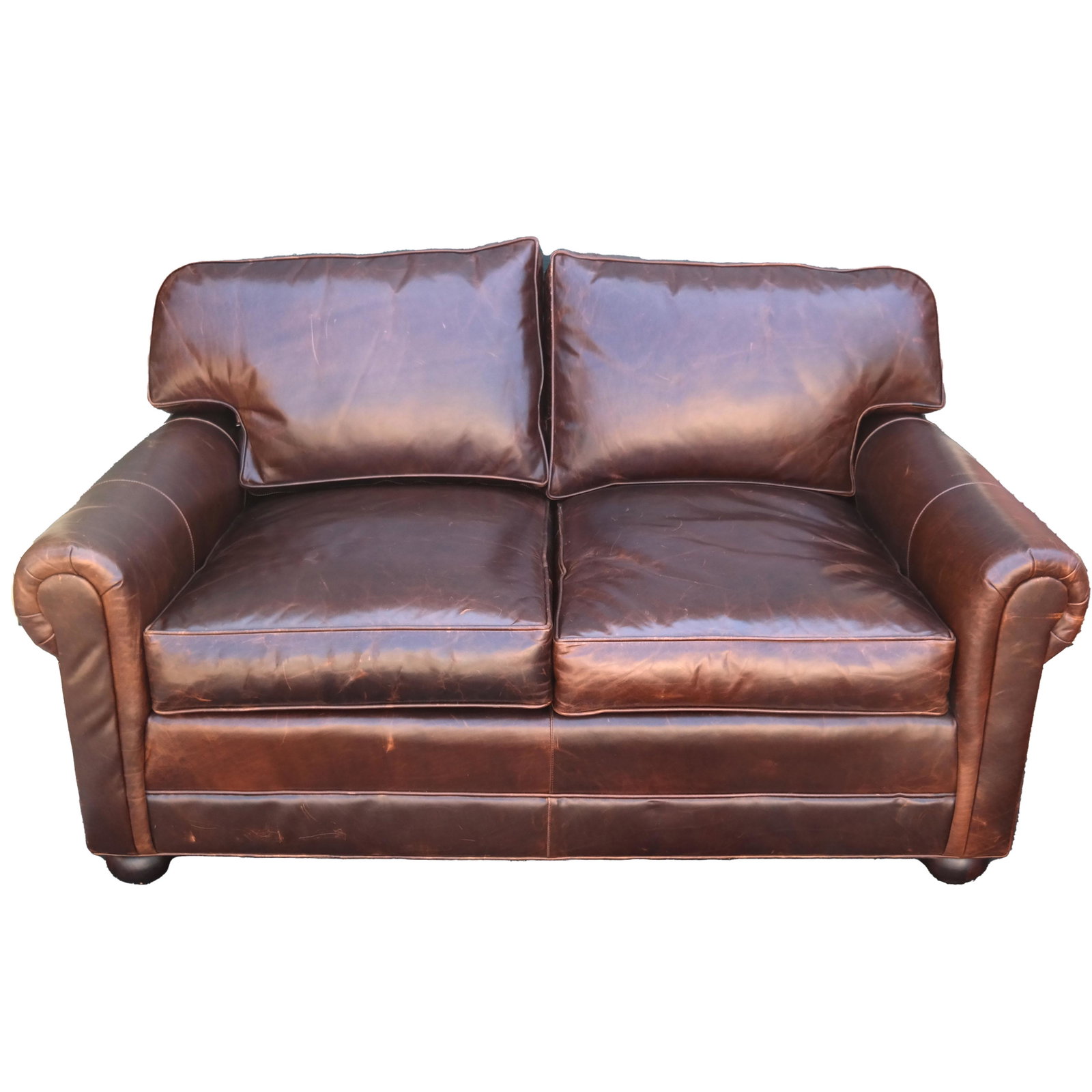 Brown Leather Sofa: Brown leather sofa with loose cushions. Late 20th century. [31" H x 66 1/2" W]. Some dents, scratches, and wear.