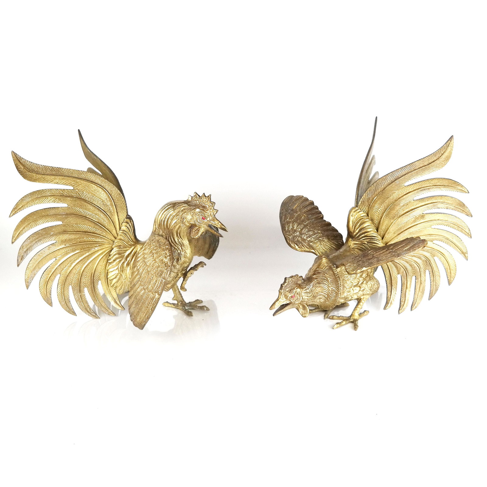 Pair of Gilt Metal Models of Roosters: Pair of gilt metal models of roosters. [10 1/2" H x 9" W x 11" D]. Later painted eyes, residue, some oxidation and wear.