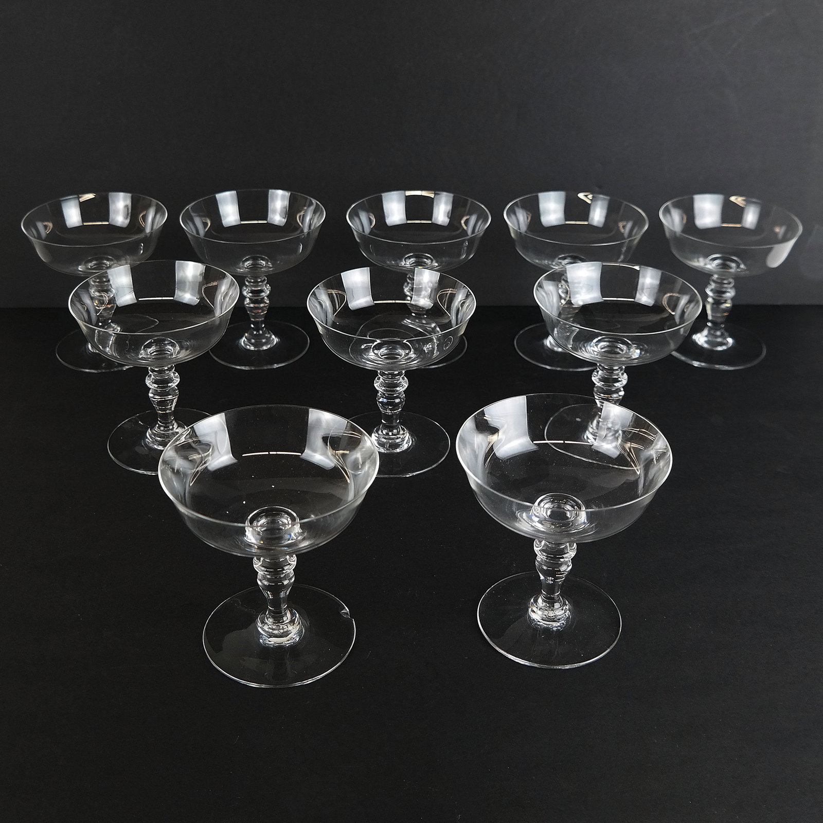 Ten Baccarat Clear Crystal Coupes: Ten Baccarat clear crystal champagne or sherbet coupes, in the provenance pattern. Marked to bases. [4 1/2" H x 4 1/4" Diam.]. In overall good condition.
