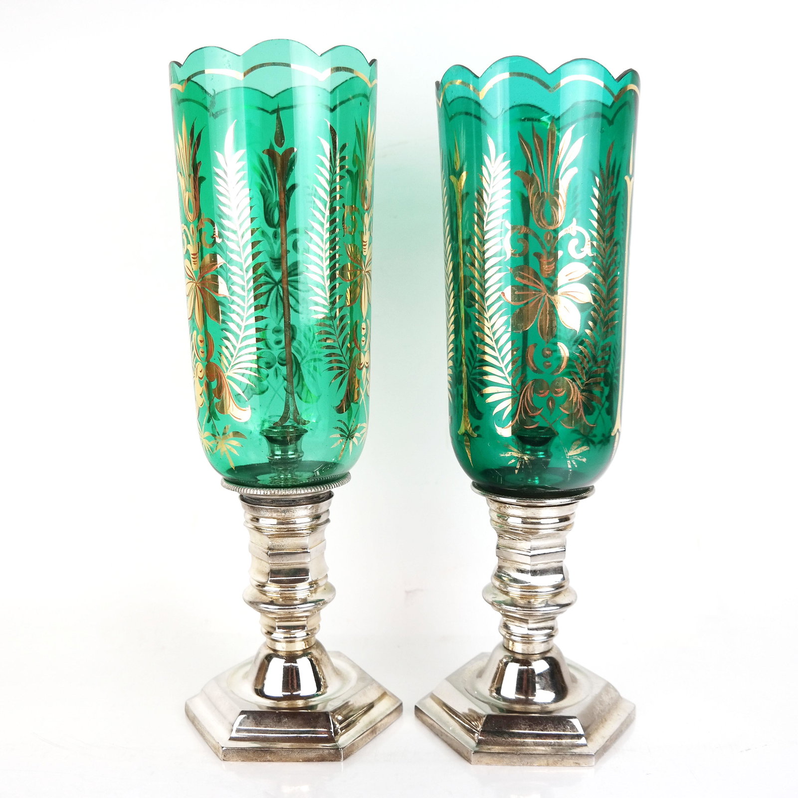 Pair of Victorian-Style Photophores: Pair of Victorian-style photophores, possibly English, each having a gilt-accented green glass shade with scalloped rim over the candlestick base. [17" H x 6" Diam.]. Minor wear.