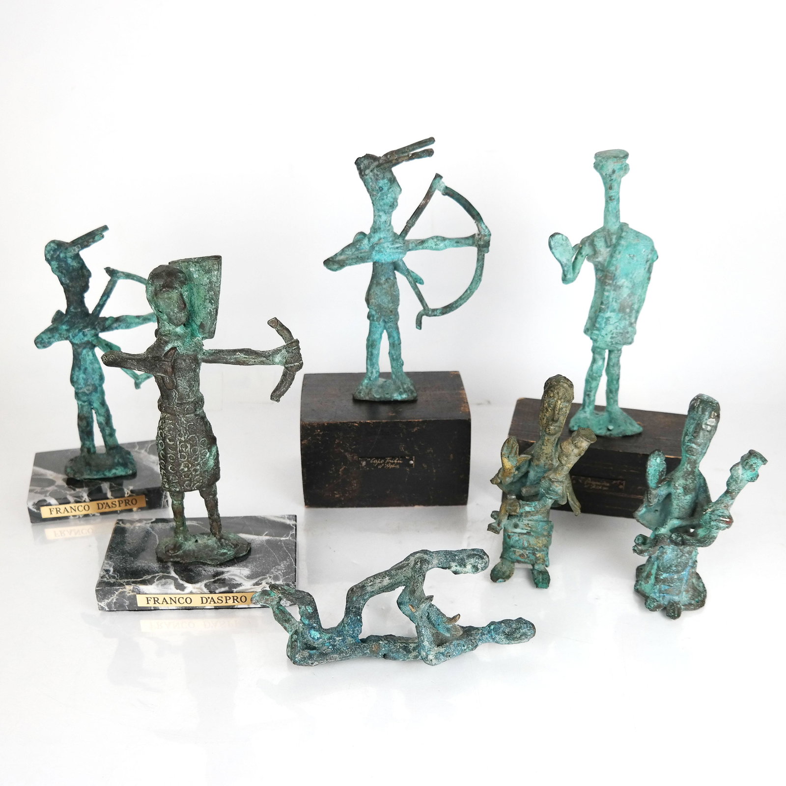 Seven Franco D'Aspros Bronze Sculptures: Seven Franco D'Aspros bronze sculptures, including three archers and four others. [Largest: 8 1/2" H]. Worn.