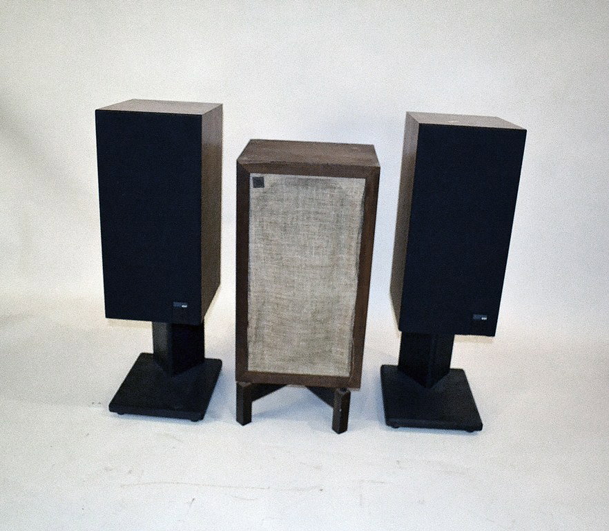 Pair of Kef Speakers: Pair of Kef "Reference Series" speakers on stands. 10.5" width x 34.5" height x 12.5" depth.