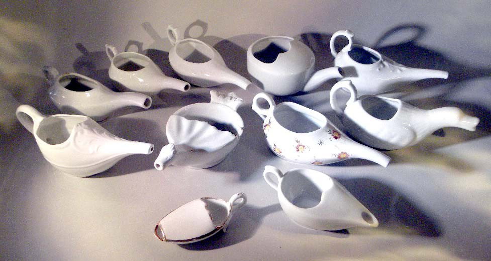 Fifteen Gravy Creamers: All white, 15 total.