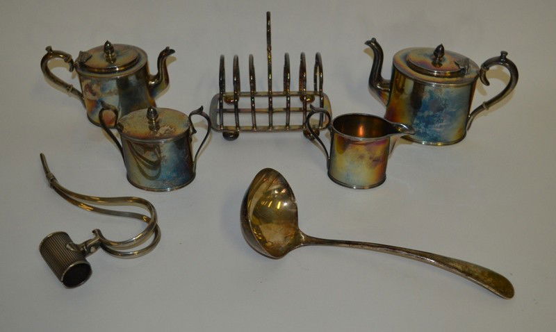 Group of Meridan Silverplate w/ Assorted Table Articles: A group of Meridan silverplate including three assorted sizes of tea servers and a creamer, together with a large ladle, a wine bottle handle and a toast rack and nine pieces ot flatware, 15 pieces to