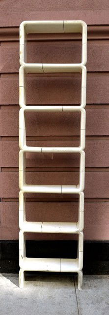 1970s White Plastic Sectional Bookcase: Having six capsule form compartments.