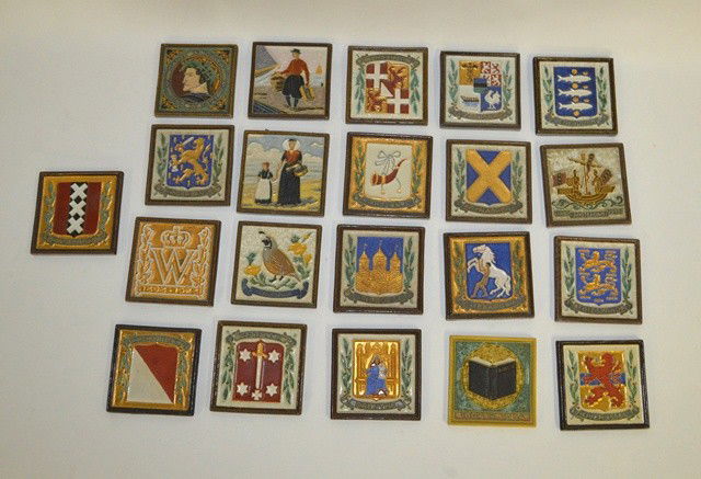 Group of 21 Glazed Earthenware Tiles: Group of 21 assorted Dutch glazed earthenware tiles. All with impressed factory marks including city arms and comm. Tiles. Largest: 7 7/8" x 5.5"