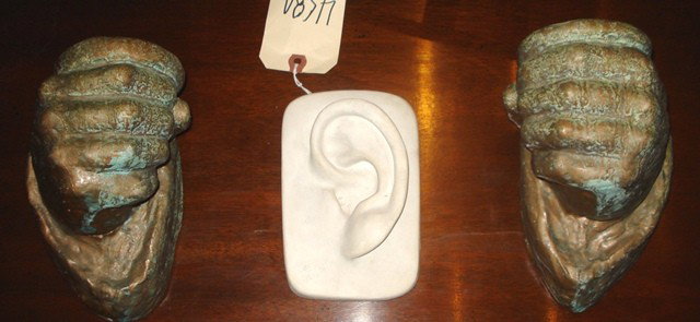 Pair of Hands & One Ear: Pair of fist wall candlesticks, together with a plaster ear. Good condition. 5" - 7" H (approx)