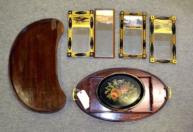 Early American Style Trays and Mirrors: Lot of Early American style trays and mirrors. Comprises three mahogany and two tole serving trays. Accompanied by four diminuative trumeau type mirrors with patriotic scenes.