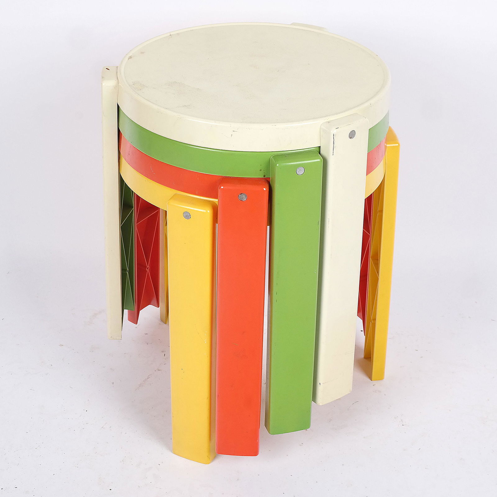 Aalto-Style Mid-Century Nesting Tables (4): Four Aalto-style mid-century multicolor stacking tables. [17" H x 18" Diam.]. Some stains and wear.