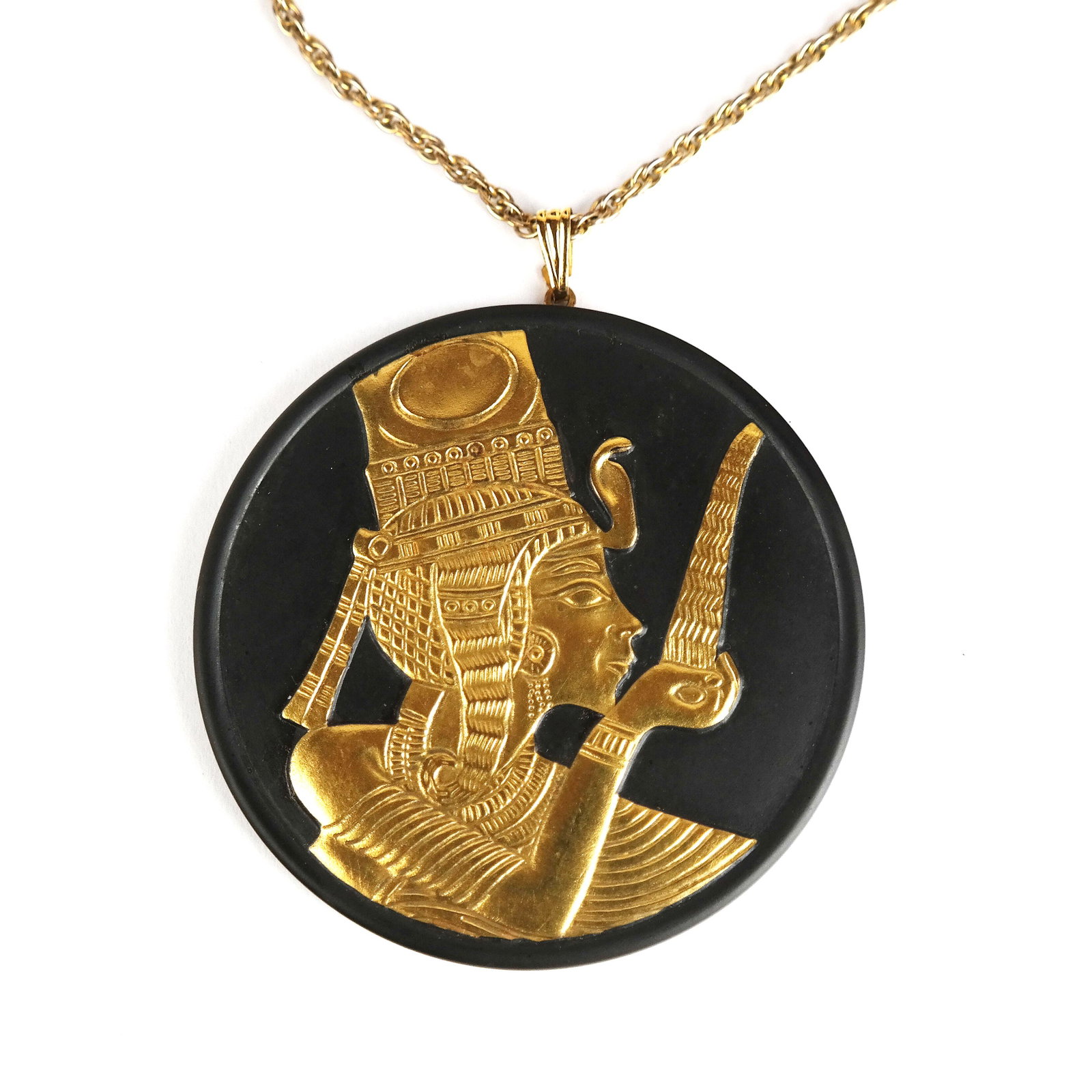 Wedgwood Egyptian Collection Pendant: Wedgwood Egyptian Collection gilded black basalt pendant featuring Ankhesenamun. Comes with original chain and box, circa 1978. [2 7/8" D]. Some wear but in good condition.