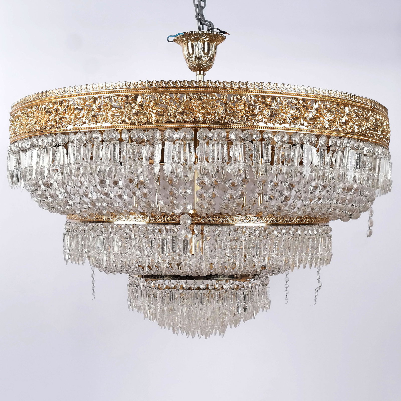 Empire Revival Gilt Bronze & Glass Chandelier: Empire revival gilt bronze and glass chandelier, the drum form cage with tiers of prism drops. [32" H x 39" Diam.]. Some strands detached.