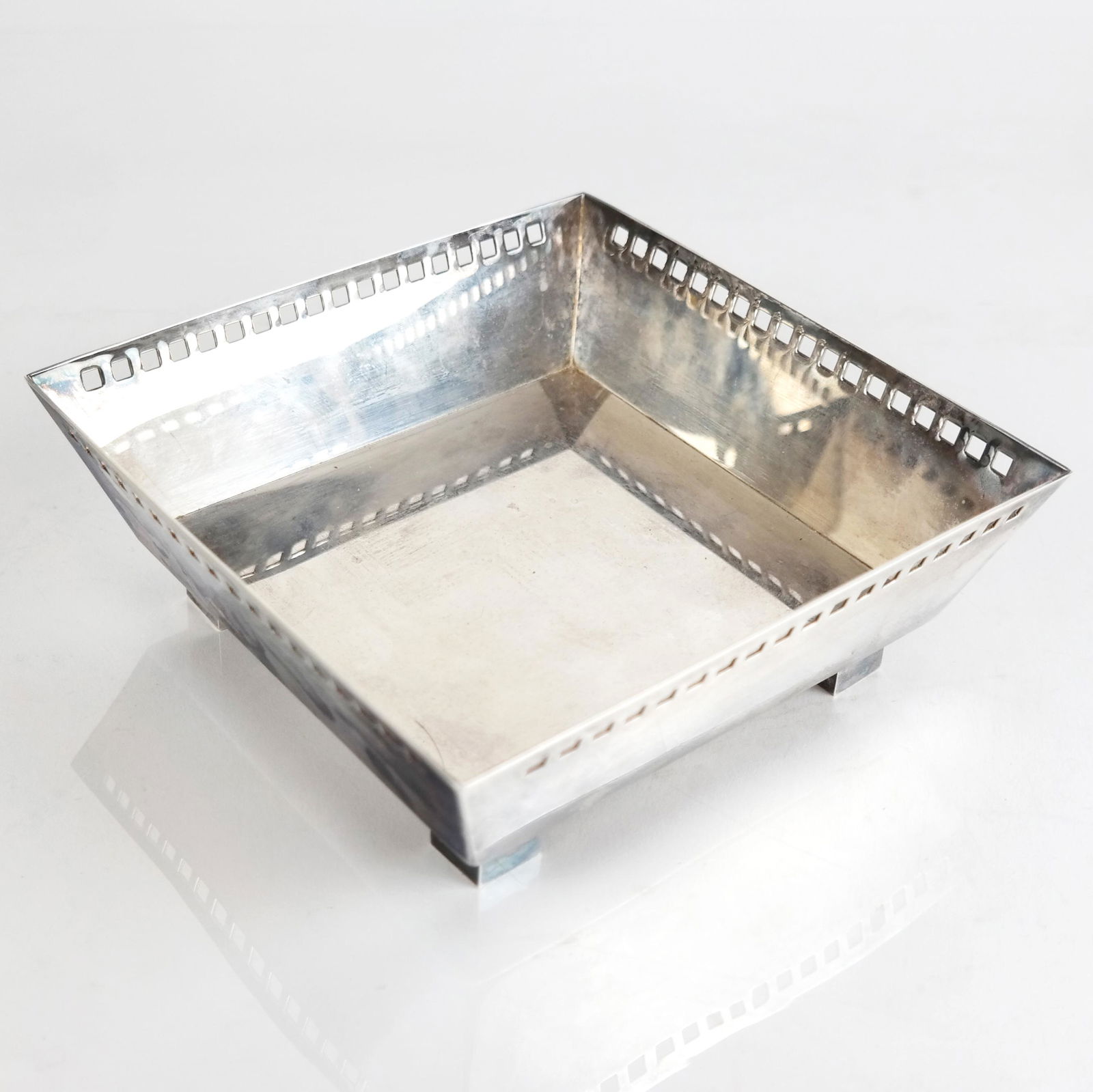 Richard Meier for Swid Powell Silverplate Bowl: Richard Meier for Swid Powell Italian silverplate bowl with retouched rim and black feet; signed to foot. [2" H x 6" W x 6" D]. Some oxidation; light wear.