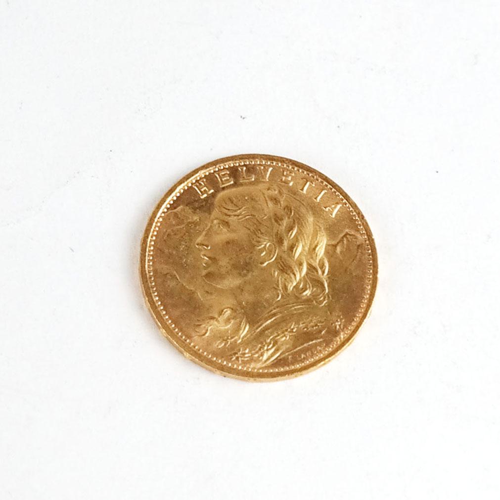 1927 Swiss 20 Franc Gold Coin: 1927 Swiss 20 franc gold coin, Helvetia, .900 gold purity. 6.48 grams.