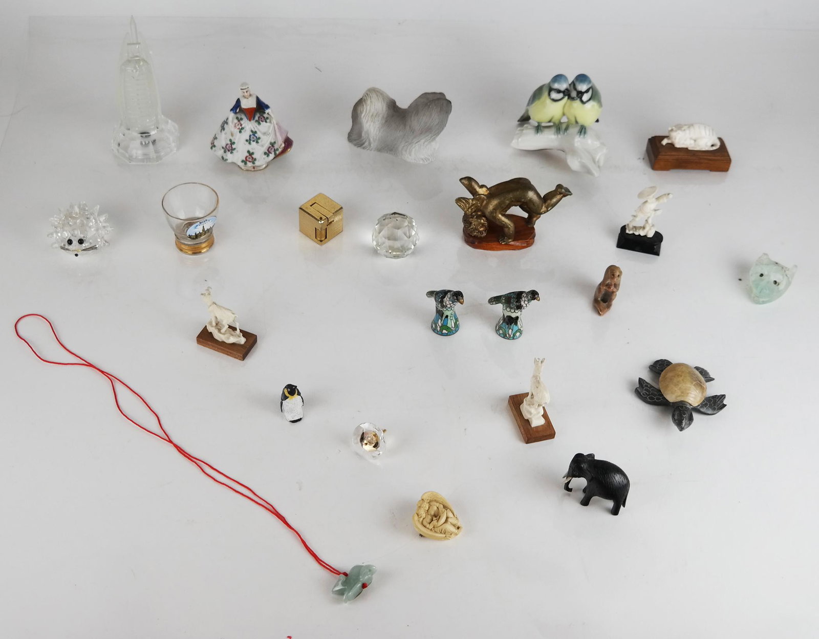 Assembled Group of Decorative Collectibles: Assembled group of decorative collectibles, in various mediums, including a glass model of the Dubai Burj al Arab, a German Lorenz Hutschen Reuther birds, a Capodimonte porcelain lady, a small lighter