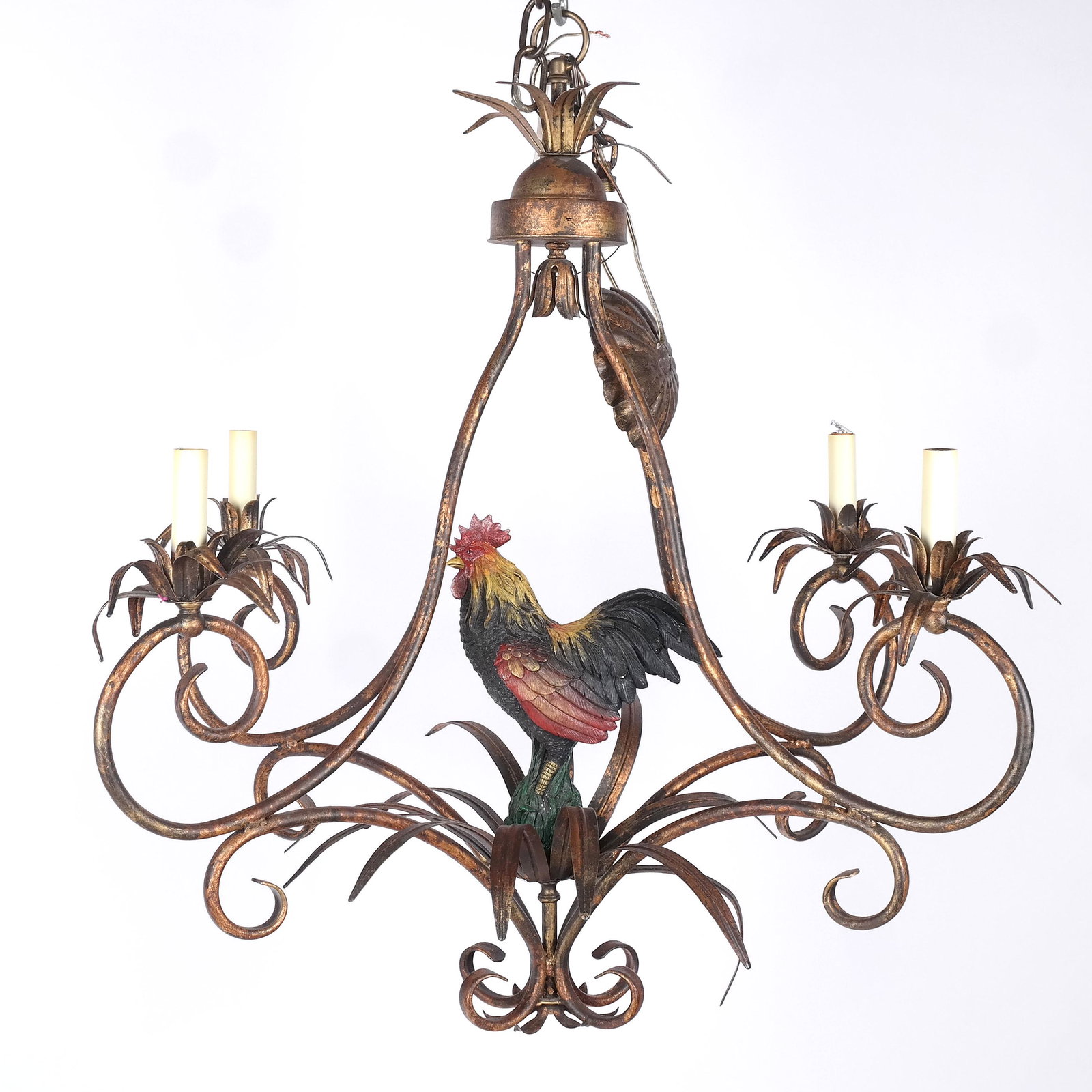 Modern Gilt Tole Chandelier: Modern gilt tole chandelier with four leaf-accented scrolling arms and centered with a proud coq. [34" H x 29" Diam.]. Minor bending and wear.