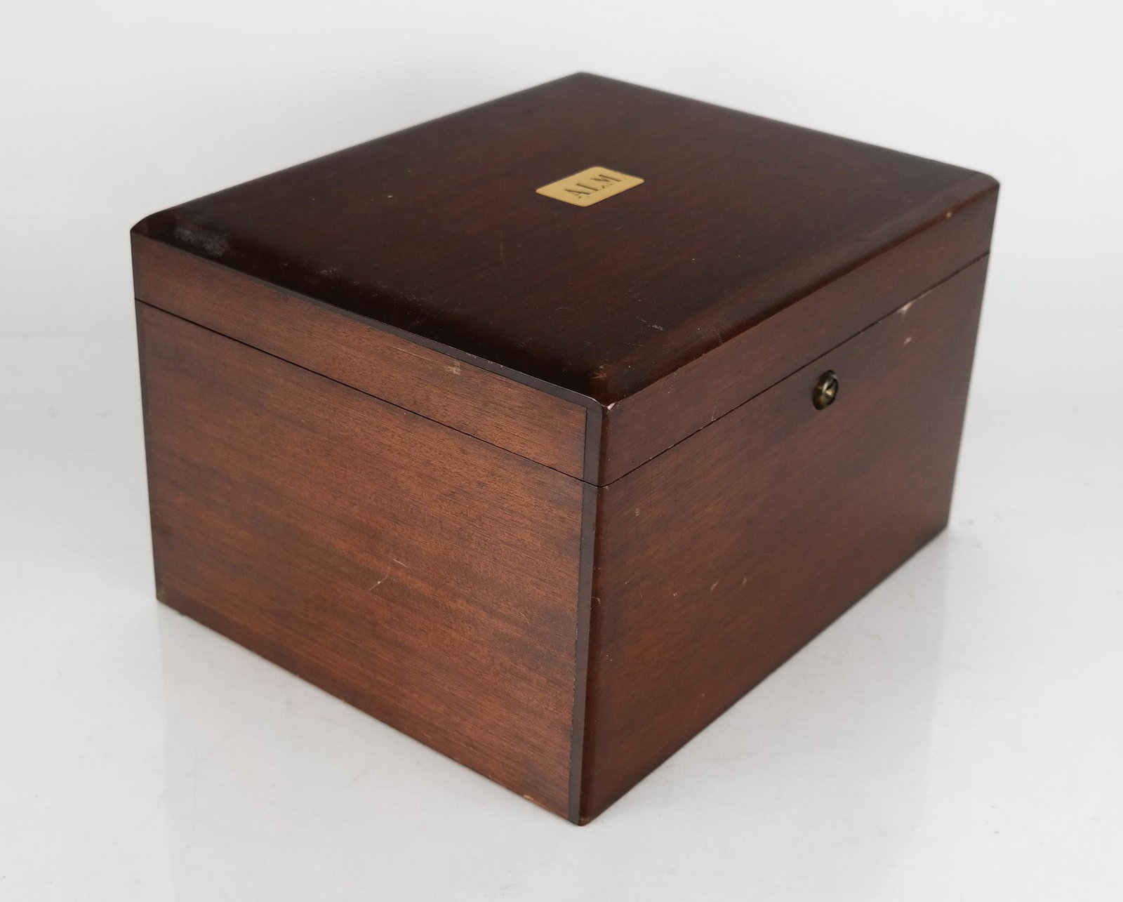 Mahogany Humidor Box: Mahogany humidor box, possibly English, with monogram plaque to top "ALM". Scuffs and wear, interior distress and with stains and residue.