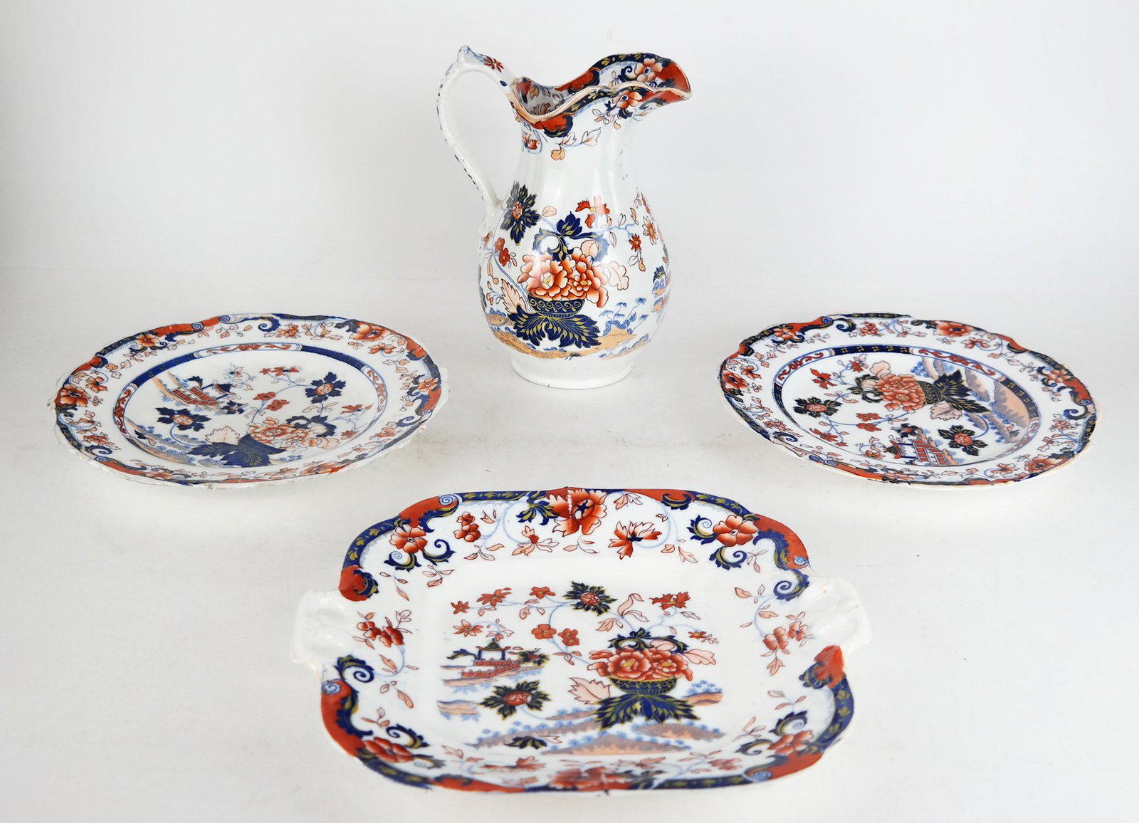 4 Pcs. Amherst Japan Ironstone China: 4 pieces Amherst Japan ironstone china, comprising a pitcher [8" H], pair of plates, and a square plate. Numbered 62, 824, and 826.