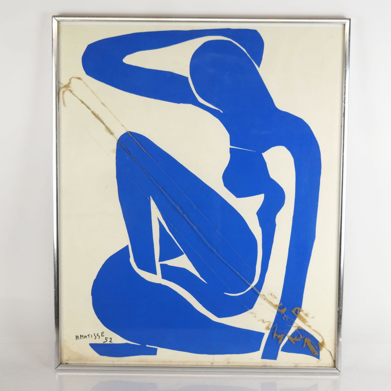 After Henri MATISSE: Nude in Blue - Print: After Henri Matisse (French, 1869-1954) nude in blue print from Dernières Oeuvres De Matisse. Framed, matted, under glass. [Print: 22" H x 17 1/2" W]. In fair condition. Creases and glass cracked.