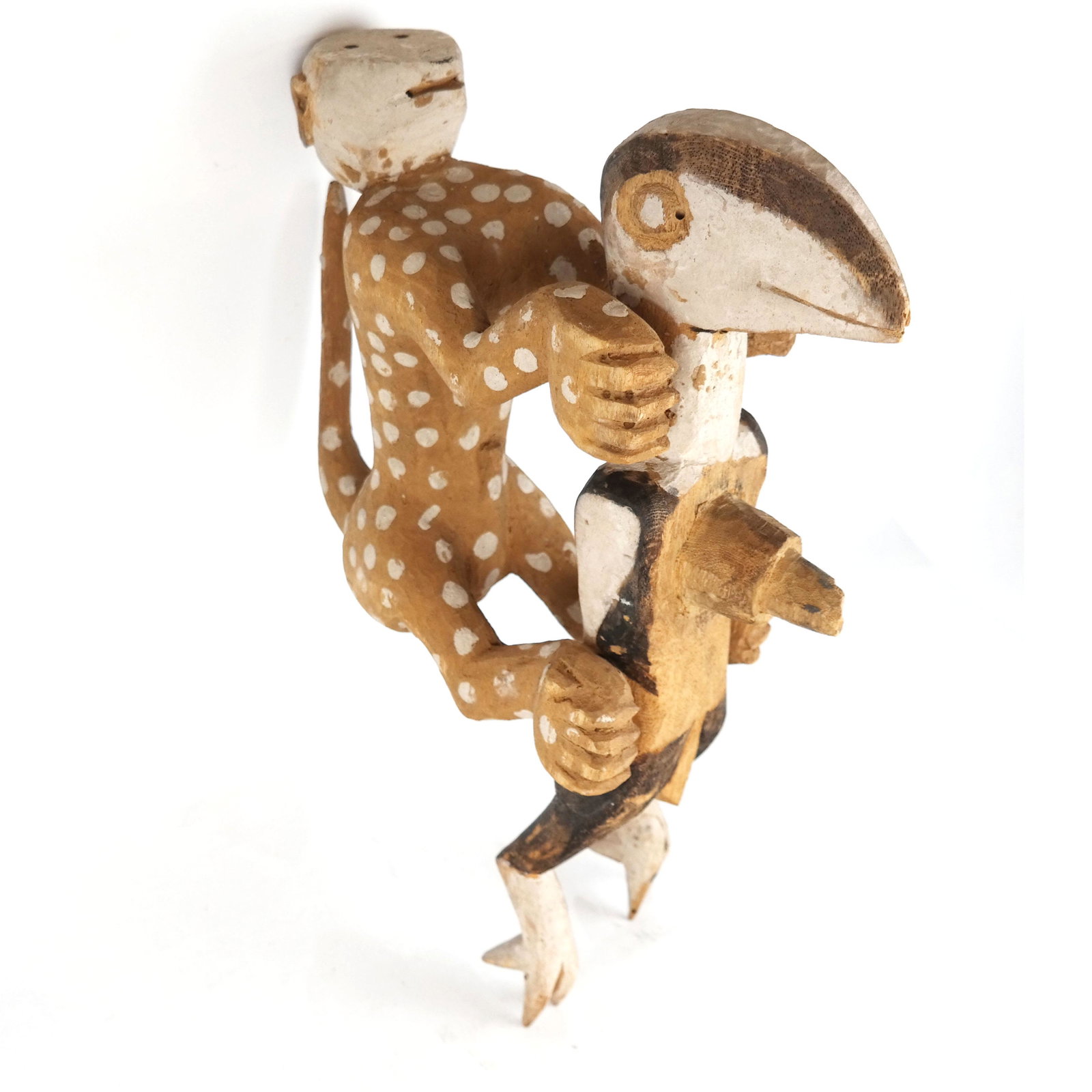 Tibetan/Oceanic-Style Sculptural Monkey: Tibetan/Oceanic-style sculptural monkey atop cockatoo, carved and painted. [12" H x 7" W].