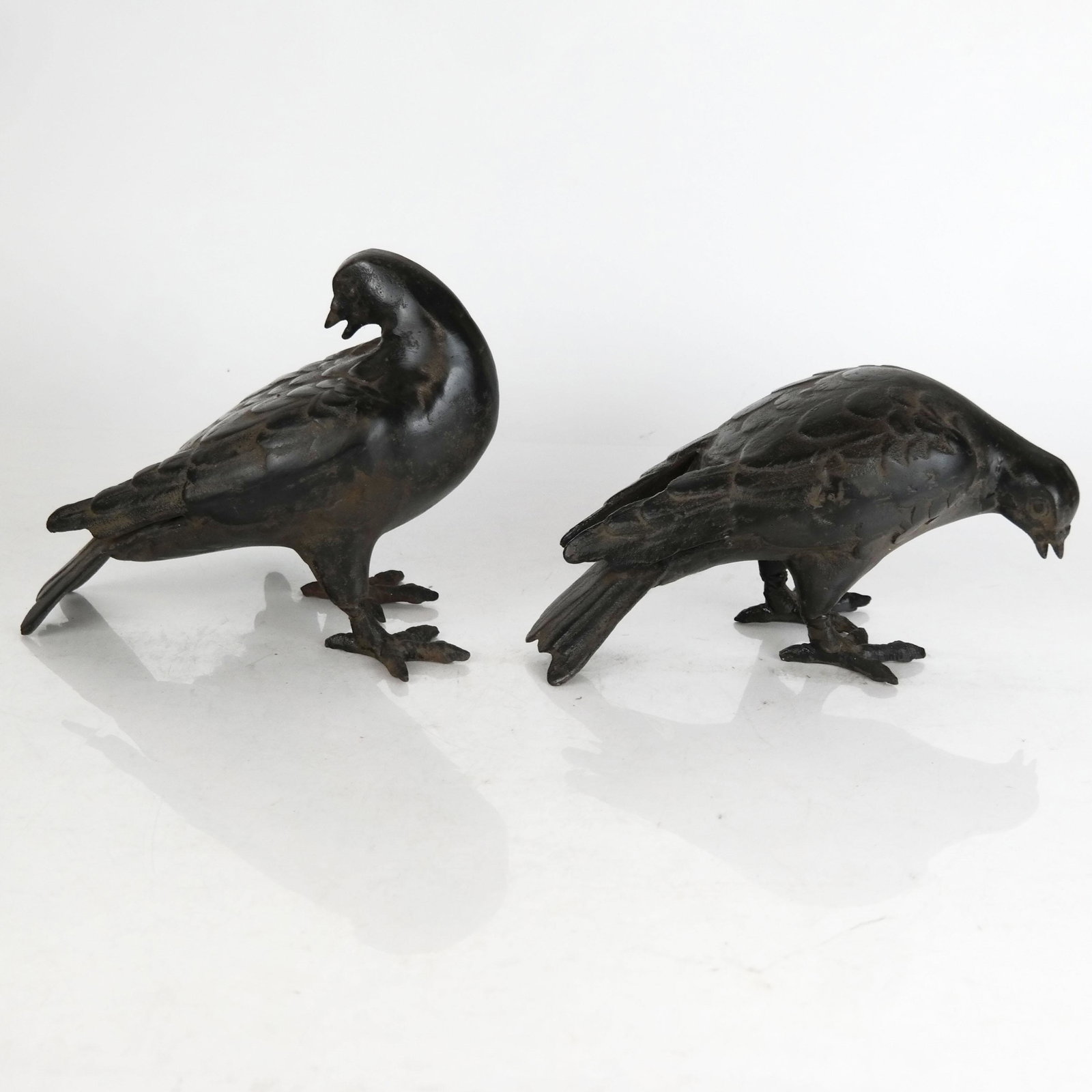 Two Iron Models of Birds: Two iron models of birds, unmarked. [5 3/4" H x 8" W x 5" D]. Dust and wear.