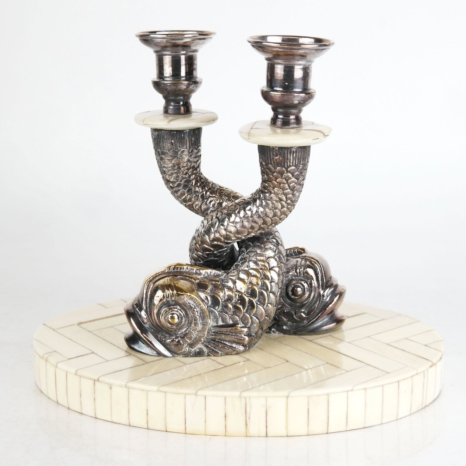 Modern Baroque-Style Bone & Metal Candlesticks: Modern Baroque-style bone and metal candlesticks modeled as intertwined dolphins. [7 1/2" H x 9 1/2" W x 6 1/2" D]. Some lifting and wear to veneers, wear and losses to metal finish.