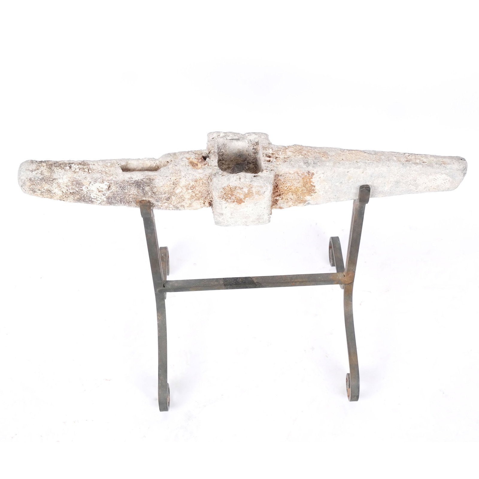 Limestone or Stone Anchor on a Stand: Limestone or stone anchor fragment on a stand. [4 1/2" H x 25 1/2" W x 4 1/2" D].