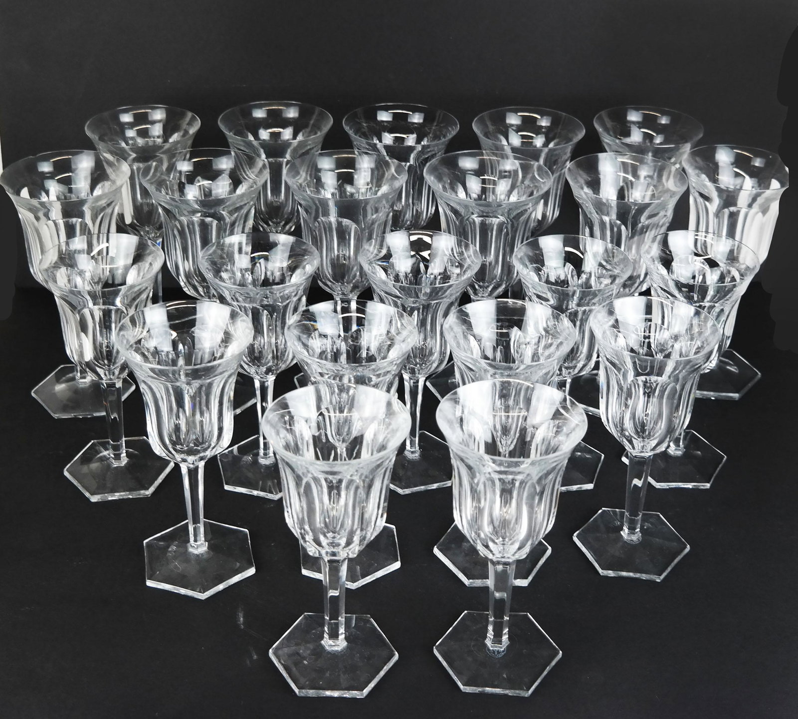 Group of Baccarat Clear Crystal Stemware (22): Group of 22 Baccarat clear crystal stemware, in the Malmaison pattern, comprising 11 water goblets and 11 claret wine glasses, etched marks to bases. [7 1/2" H and 6 3/4" H]. Chips to a few edges, scu
