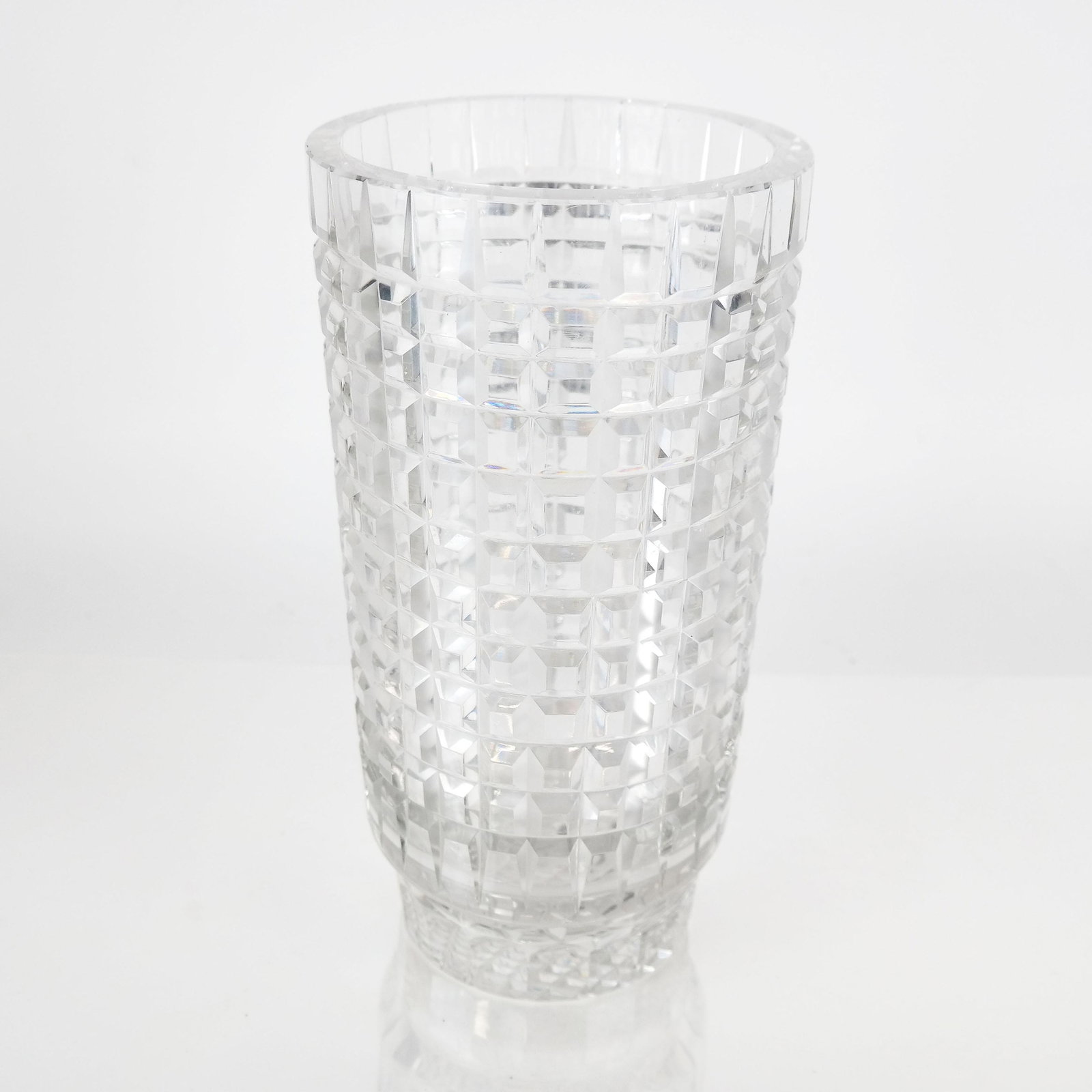 Baccarat-Style Crystal Vase: Baccarat-style cylindrical vase in cut repetitious tapered square pattern, 20th century; not marked. [12" H x 6" Diam.]. Slight typical bottom exterior wear.