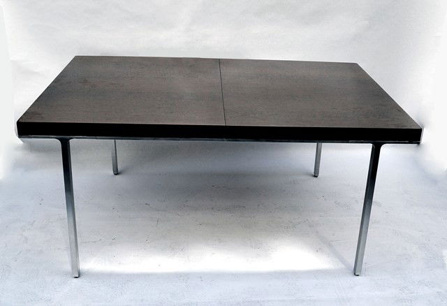 John Stuart Dining Room Table: Outstanding John Stuart mid-century modern dining table. Features bookmatched walnut veneer and continuous polished aluminum skirt with straight rectangular legs. Bears three leaves. Open: 119" x 42",