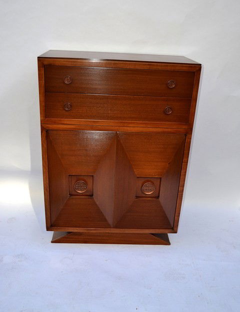 James Mont Modern Chest: A James Mont style mahogany chest, having two drawers above two geometric form doors. 35.5" L x 19.25" D x 49" H. Good condition.