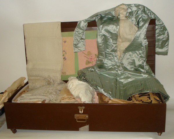 Lot of Victorian Textiles and Baby Clothes: Lot of Victorian textiles and baby clothes. Comprises needlepoint, lace, silk, and others. Approximately 40 pieces.