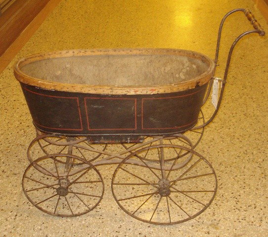 Antique Perambulator: Antique baby perambulator on wrought iron and steel chasie. As is, missing interior padding and upholstery. 40" W x 19" D x 35" H.