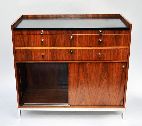 Modern Credenza: Mid-Century modern credenza, in the Herman Miller style, having chrome appliques. Good condition, some losses. 41.25" x 20.5" x 37.25".