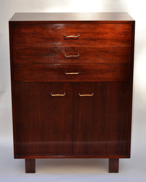 George Nelson for Herman Miller Chest : Modern mahogany chest, with three drawers above two doors, having brass shaped pulls. Label: George Nelson Design, Herman Miller. 18.5" D x 46" H x 34" L.