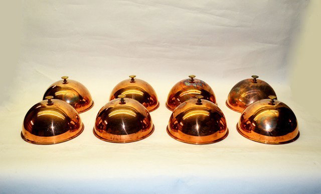 Eight Copper Covers: Eight casserole covers, worn condition. 10" Dia x 7" H. (approx.)