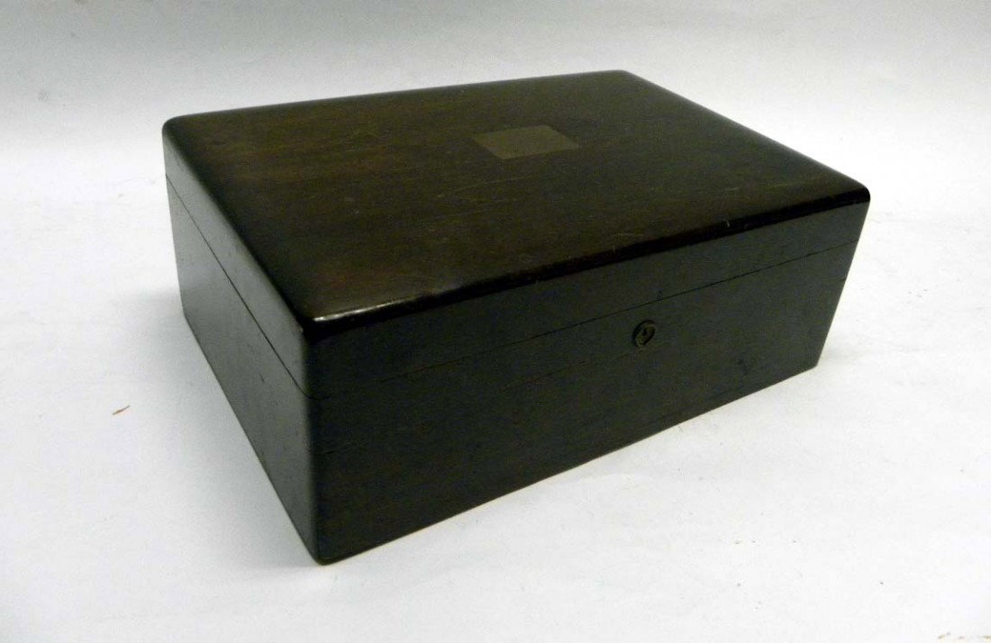 Mahogany Humidor: A mahogany humidor lined with cedar joints. Lacking key. Some wear and scratches. 4.5" H x 12.5" W.