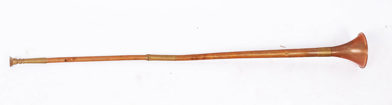Vintage English Buisine Trumpet: Vintage English Buisine trumpet, designed in medieval times for heralds to blow fanfares, stamped "Made in England". [35 1/2" H x 3 3/4" Diam. (bell)]. Heavy oxidation, dents, creases.