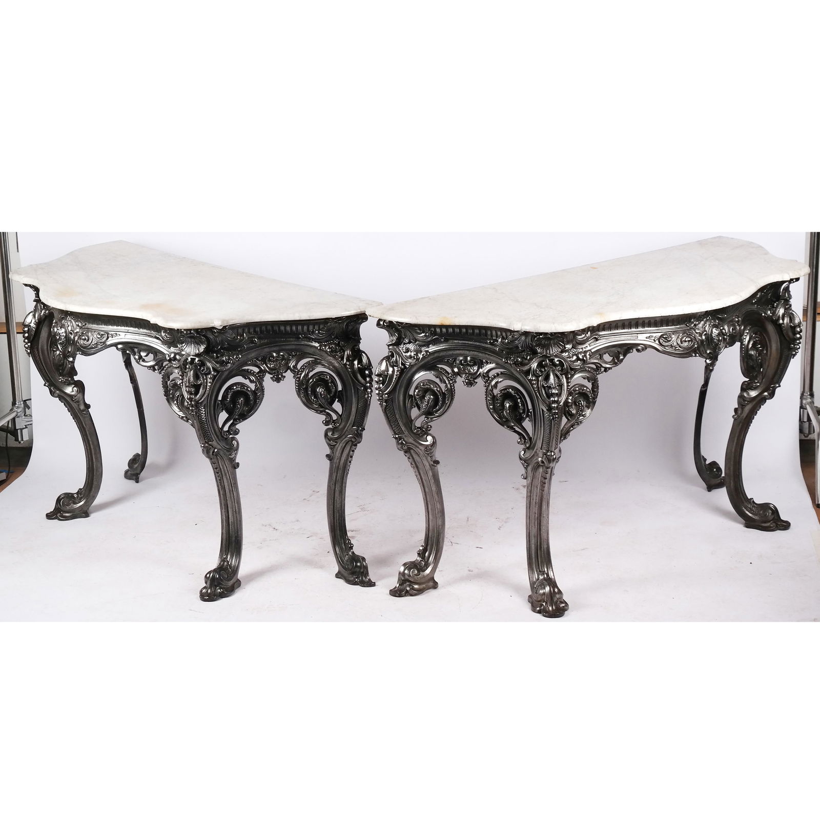 Pair of Coalbrookdale English Iron Console Tables: Pair of impressive and generously proportioned Rococo-style console tables, circa 1880, overall nicely cast with shell and rocaille scrolling details, stamped with British Patents Office registration