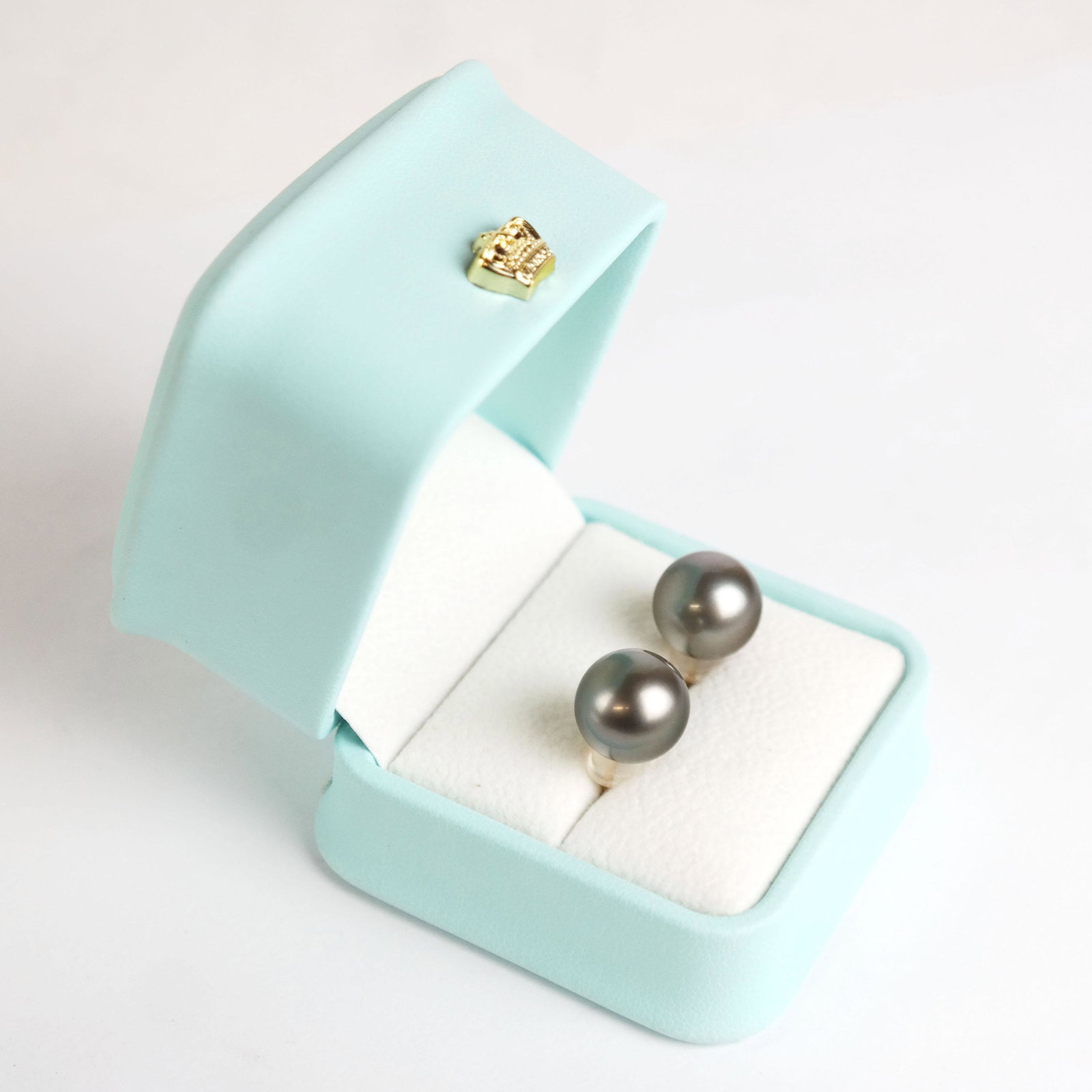 13mm Tahitian Pearl Earrings: 13mm Tahitian pearl earrings with 18k yellow gold posts.