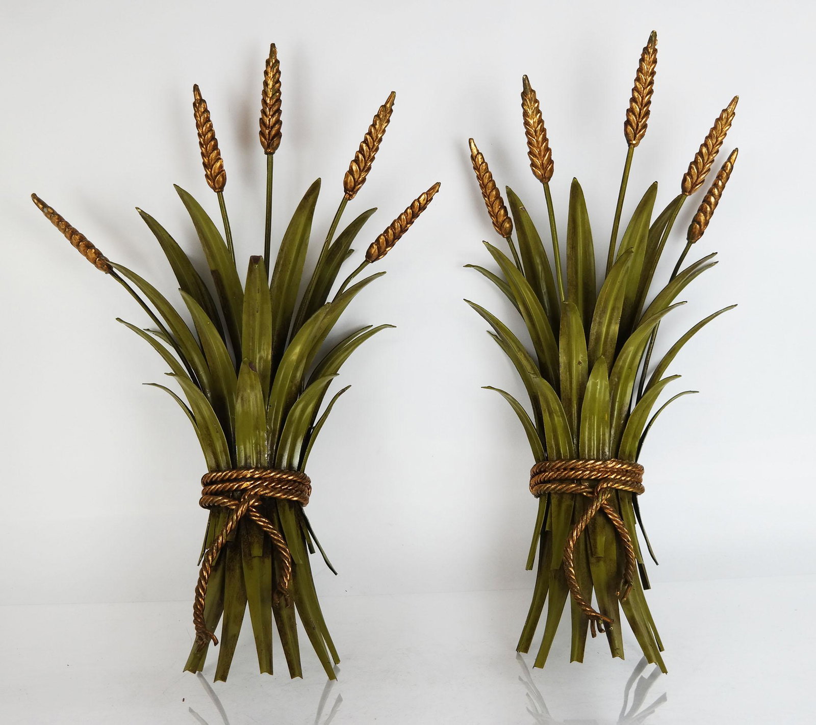 Pair of Tole Sheaf of Wheat Sconce Decorations: Pair of sconce decorations having gilt wheat and green tole fronds with gilt rope, not illuminated. [18" H x 12" W x 7" D].